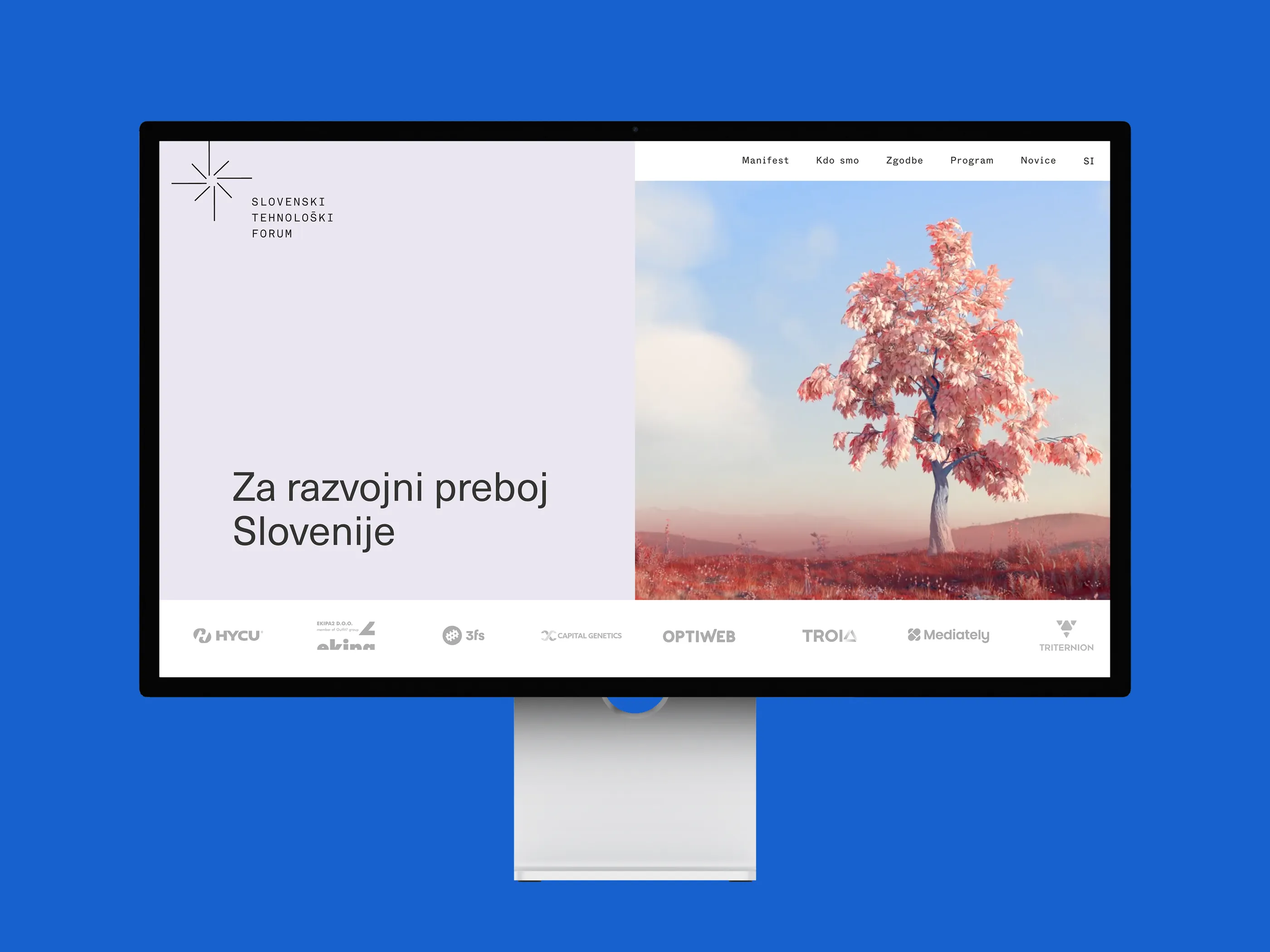 The Slovenski tehnoloski forum site on a desktop screen against a blue ground: the mark and the headline Za razvojni preboj Slovenije beside a photograph of a tree, with a row of member logos underneath